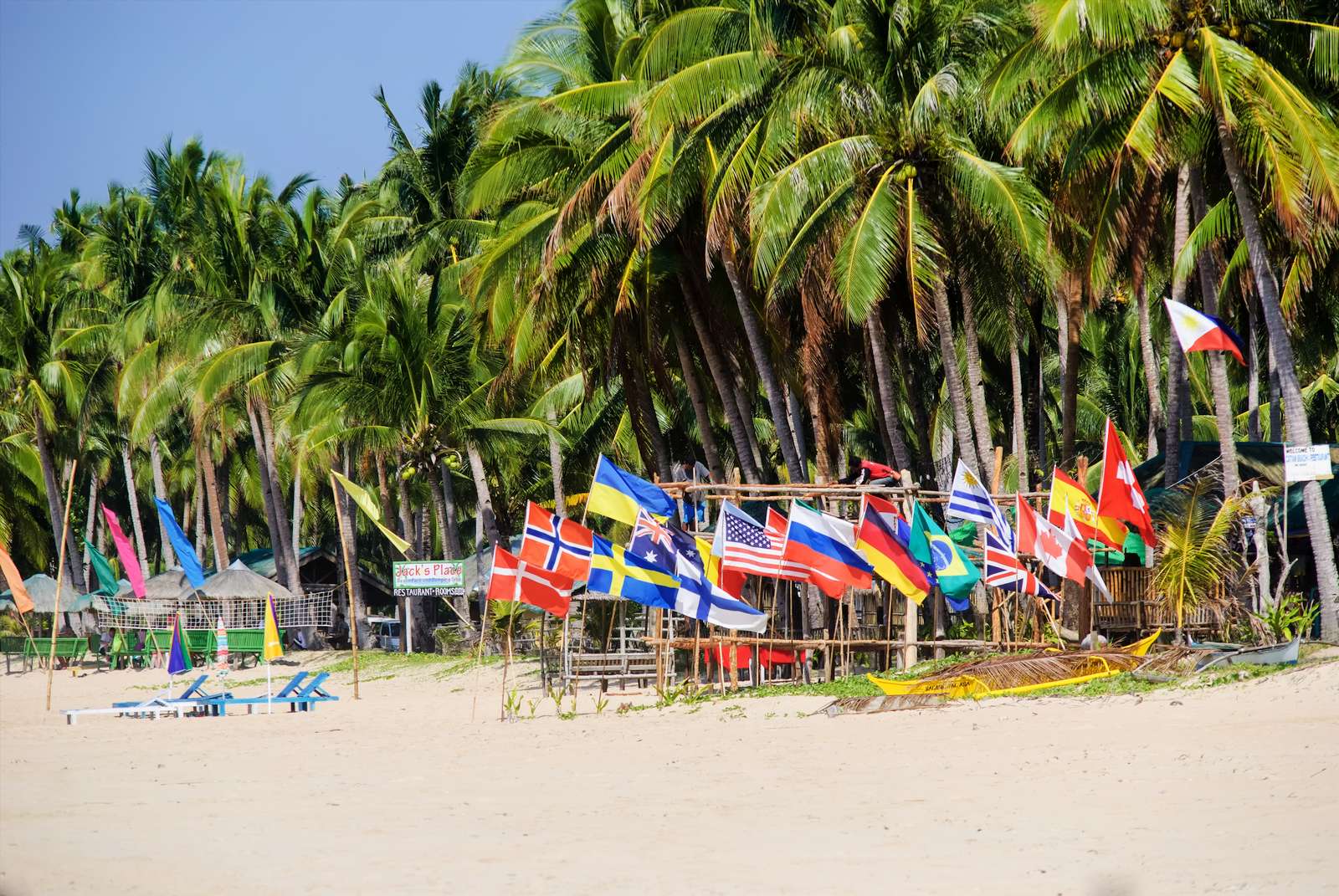 Jack's Place and its collection of flags, Nacpan Beach, El Nido