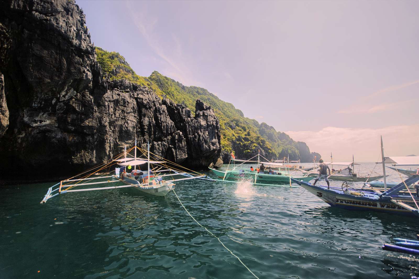 Bancas jockeying for position by the entrance to the Secret Beach, El Nido