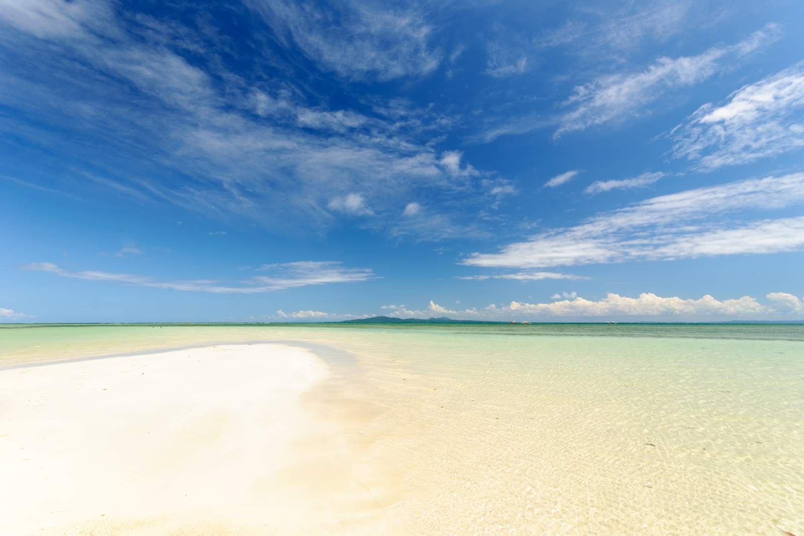 Cagbalete's blue skies, clear waters, white sands